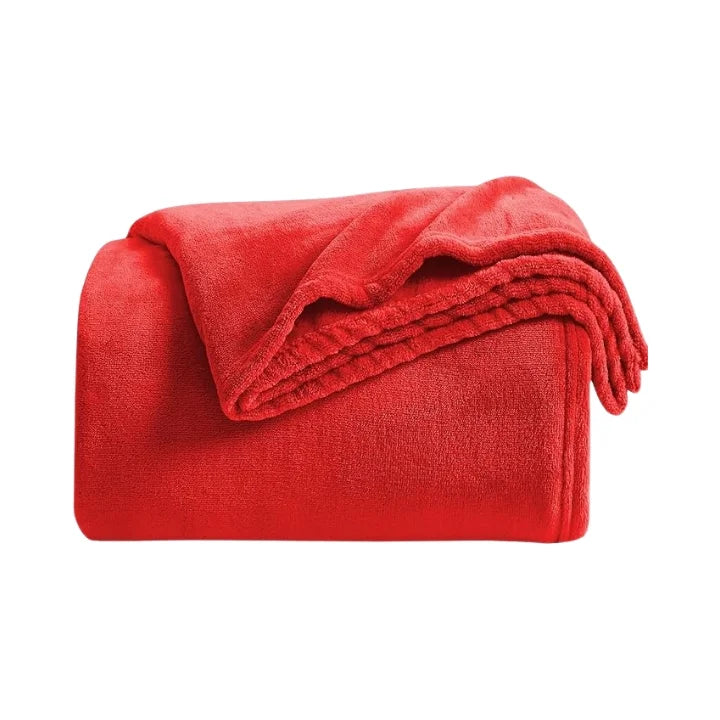 Folded red blanket on a white background