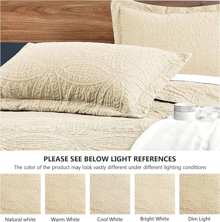Beige quilted coverlet on a bed with light references displayed below.