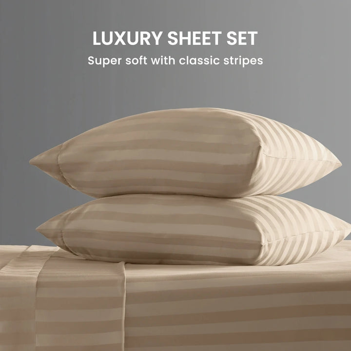 Beige striped pillows and sheet set on a gray background with text 'Luxury Sheet Set'.
