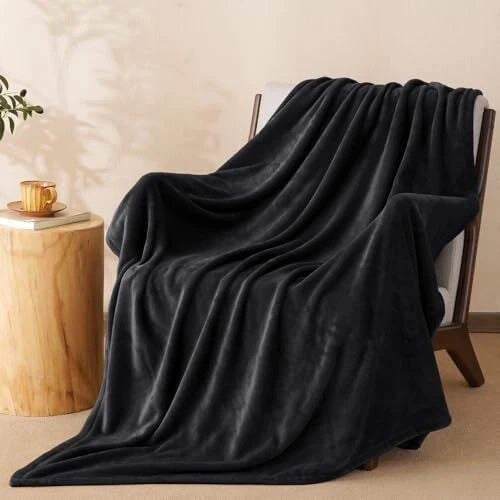 black plush throw blanket on sofa