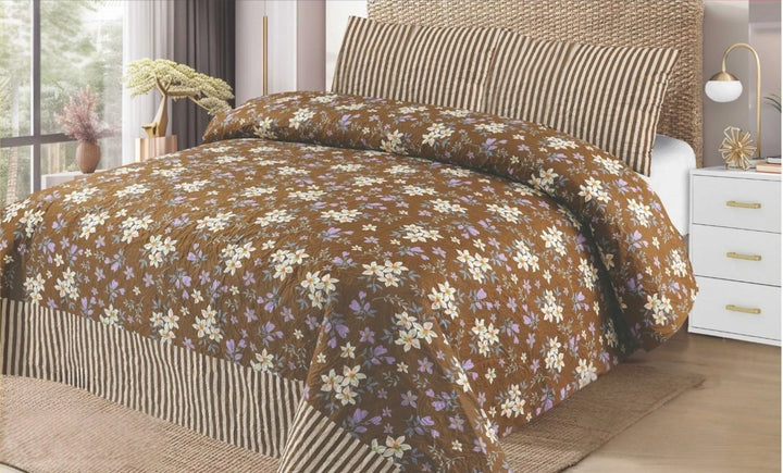 Floral patterned comforter on a bed in a bedroom setting