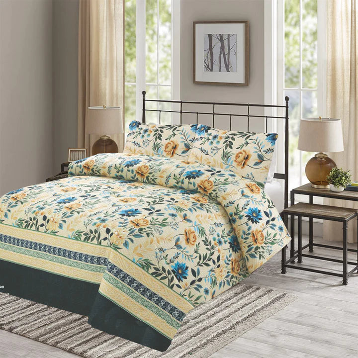 Floral bedding set on a bed in a bedroom with lamps and decor.
