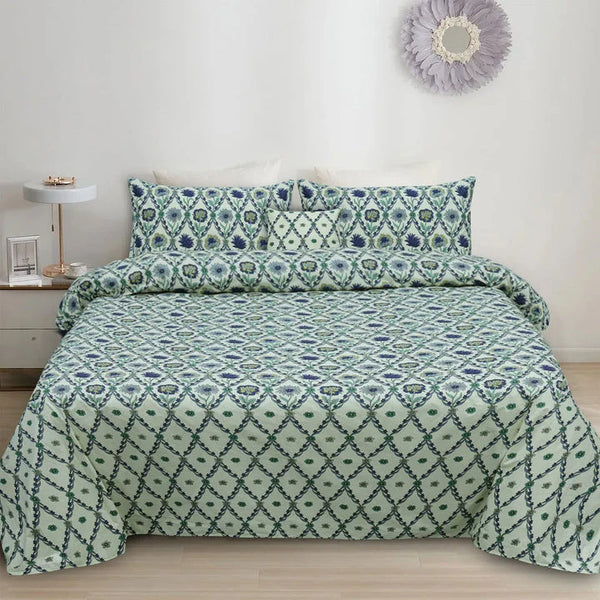Bed with green and white patterned bedding in a bedroom setting.