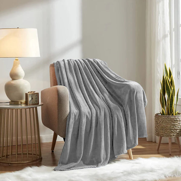 flannel grey plush blanket on sofa with great decorating background