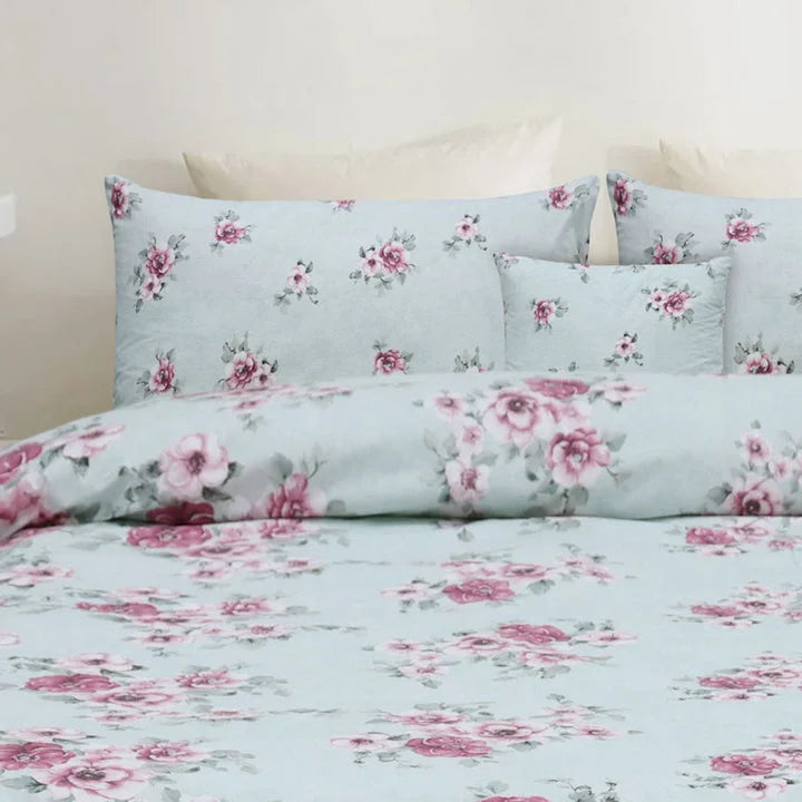 Floral bedding set with pink flowers on a light blue background