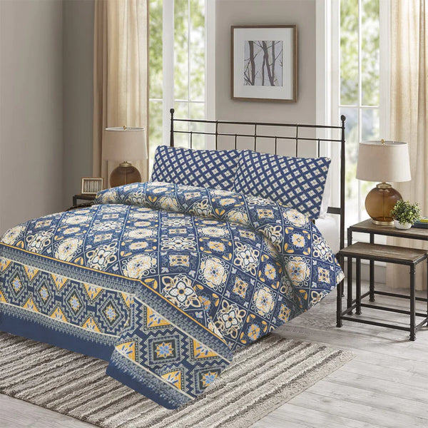 Blue and white patterned bedding set on a bed in a bedroom with windows and lamps.
