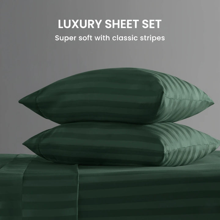 Green striped pillowcases on a matching sheet set with text 'Luxury Sheet Set' and 'Super soft with classic stripes'.