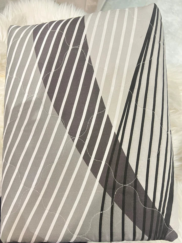 Striped pillow with brown, beige, and white pattern on a soft surface