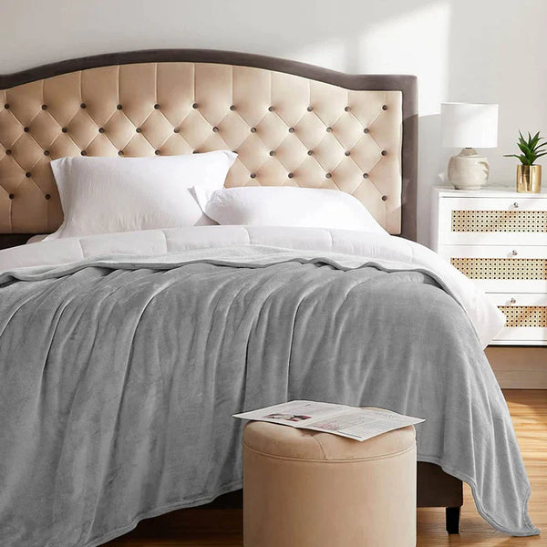 flannel grey plush blanket on bed