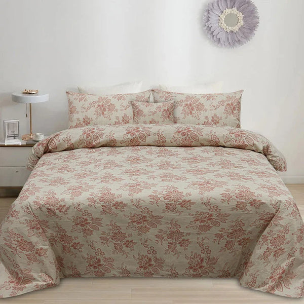 Floral patterned bedding set on a bed in a bedroom setting.