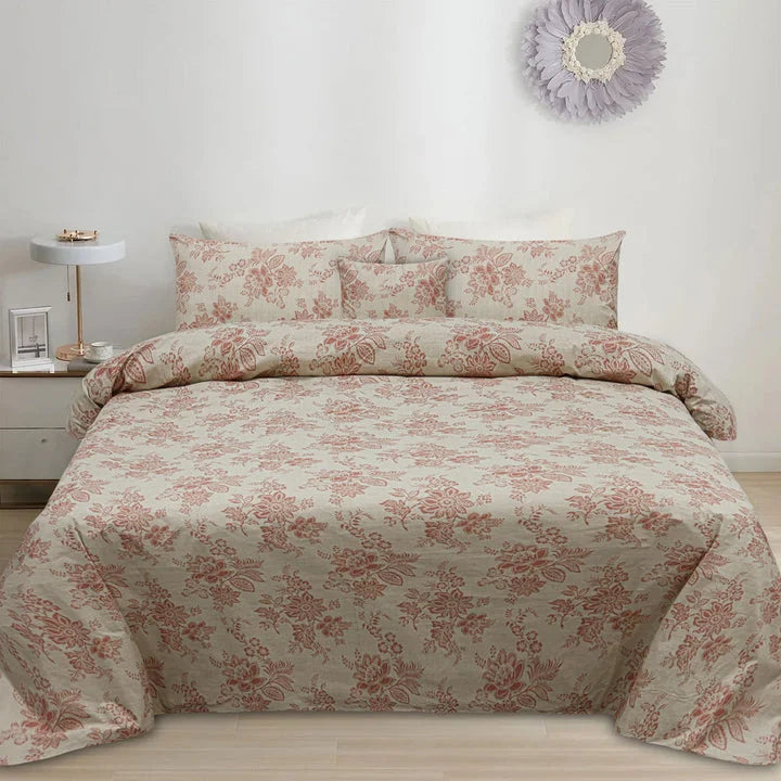 Floral patterned bedding set on a bed in a bedroom setting.