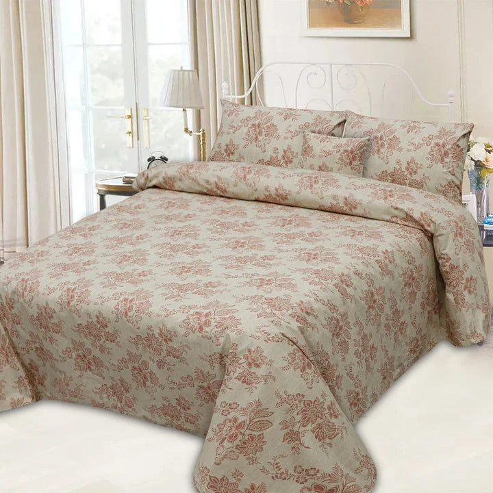 Floral patterned bedding set on a bed in a bedroom.