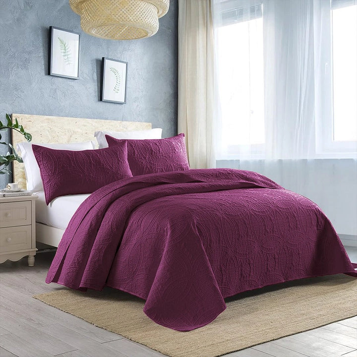 plump quilted bedspread on bed with amazing background