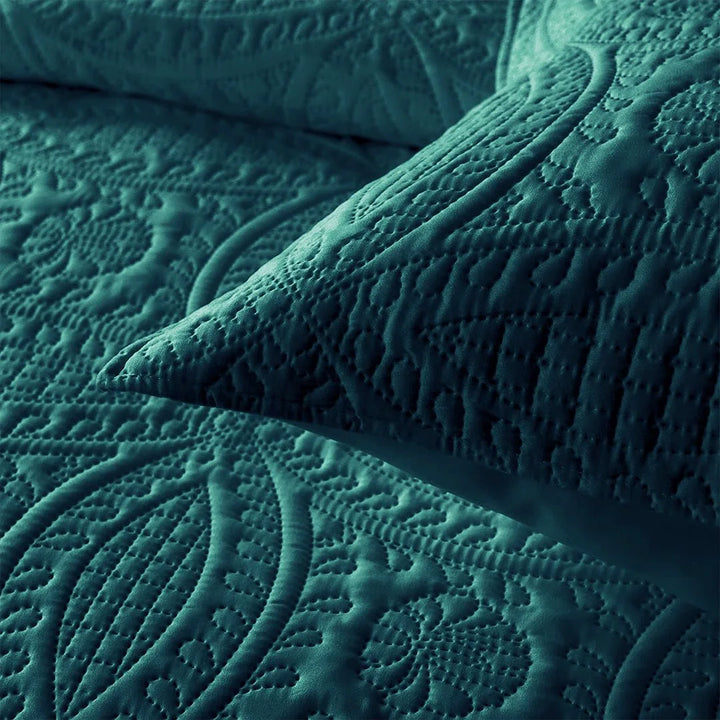 Teal textured blanket with intricate patterns