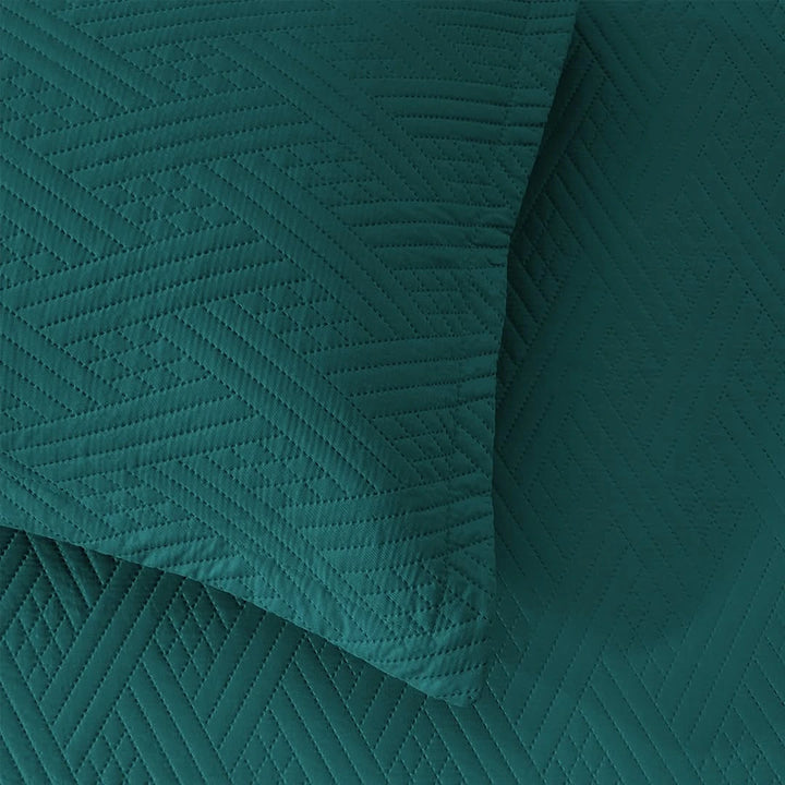 Teal textured fabric with a geometric pattern