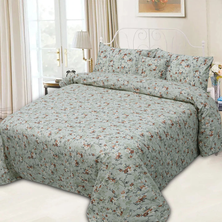Floral patterned bedding set on a bed in a well-lit bedroom.