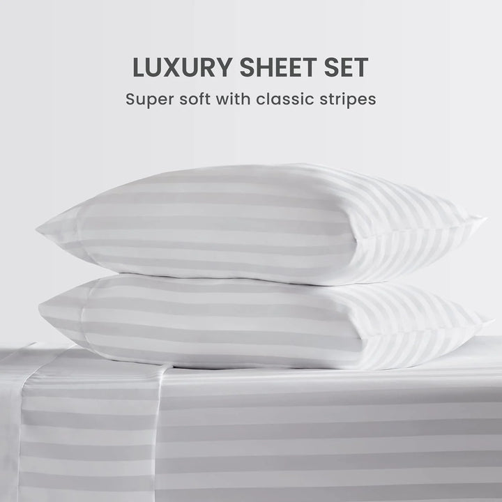 Luxury sheet set with striped design on a white background
